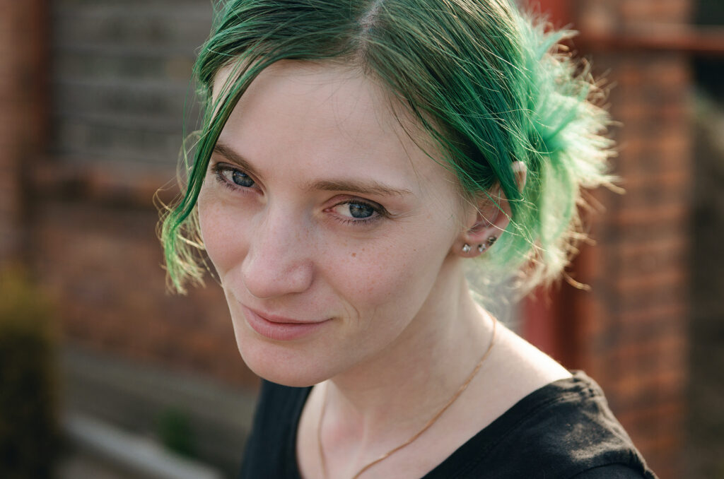 Girl with green hair.