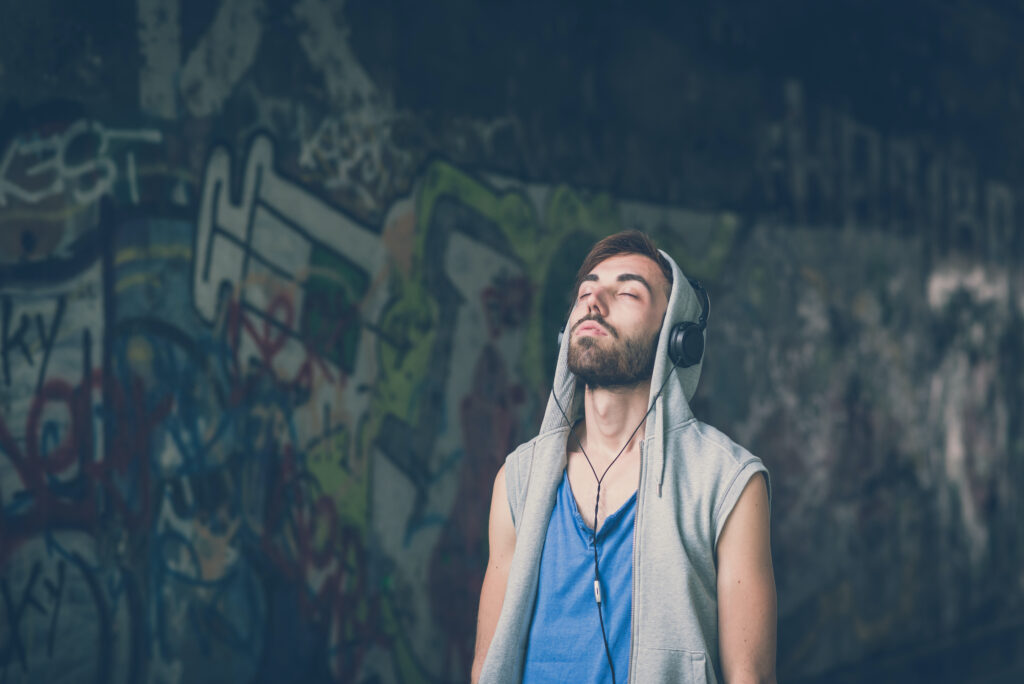 Man with Headphones looking up with eyes closed